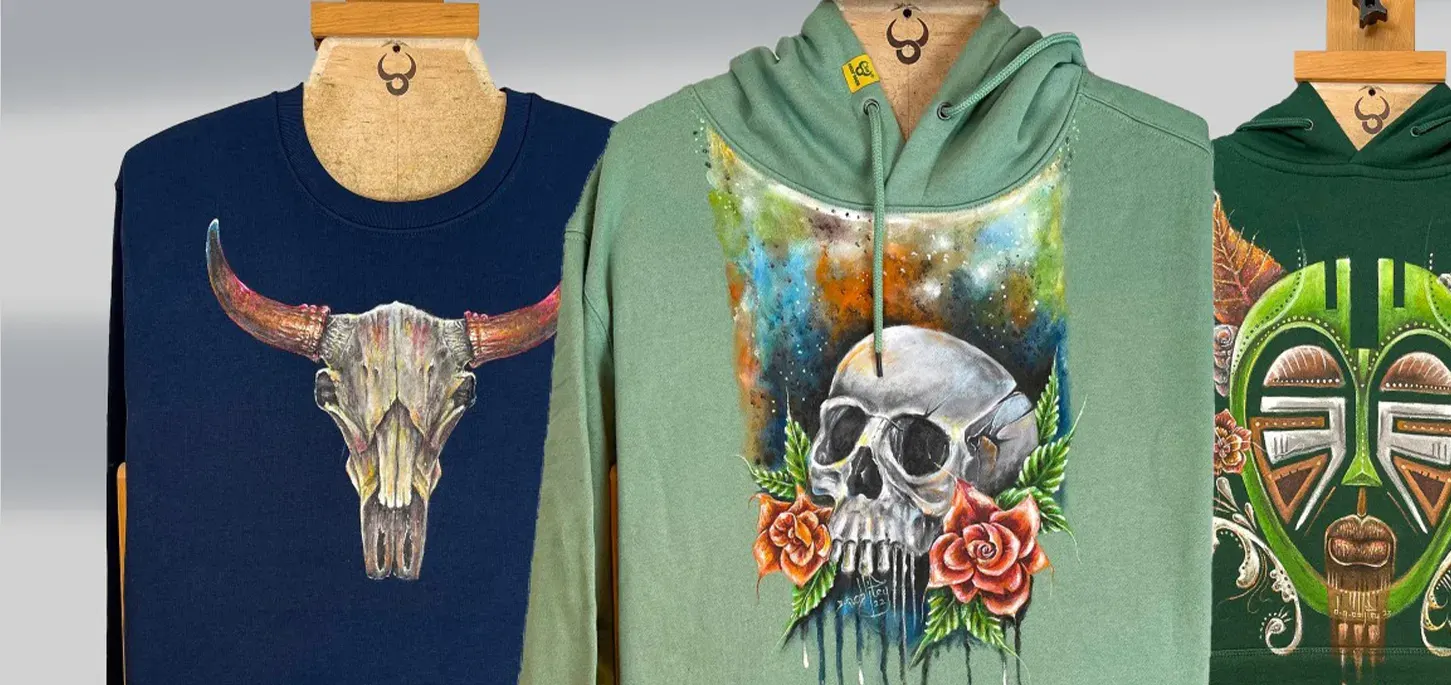 Three hand-painted Bighornns pieces hanging side by side